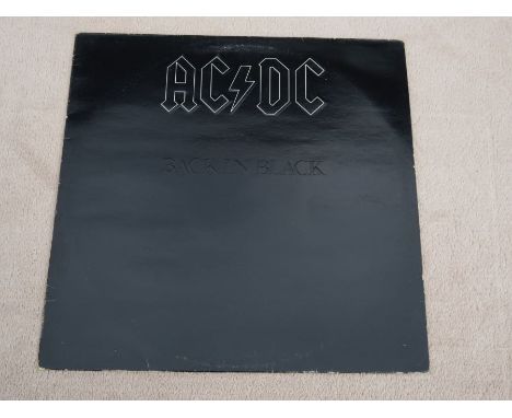 AC/DC Back In Black Original UK Vinyl LP inc inner sleeveK 50735Features Embossed album cover and card inner sleeve.The vinyl