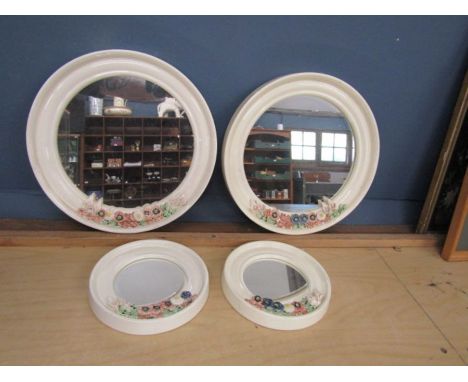 Set of 4 round ceramic framed mirrors. Largest Diameter 34cm approx&nbsp;