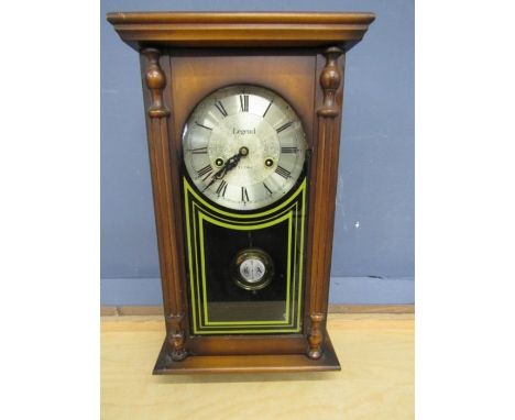 Legend cased clock with key in working order