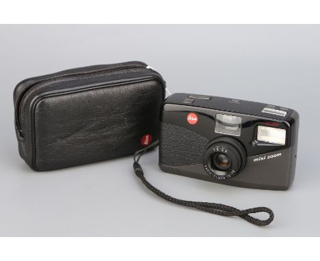 A Leica Mini Zoom Compact Camera, black, serial no. 2027560, with Leitz Vario-Elmar 35-70mm, in maker's caseThis auction is b