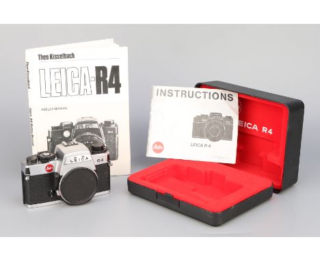 A Leica R4 SLR Body, chrome, serial no. 1590871, body, VG, shutter working on 1/100th, in presentation box, complete with The