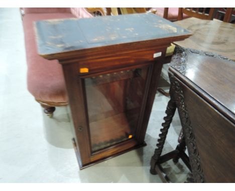 A 19th century mahogany wall cabinet having glass front and adjustable shelf interior