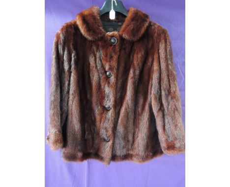 A vintage short Chestnut Mink jacket having button front, small to medium size,in great condition