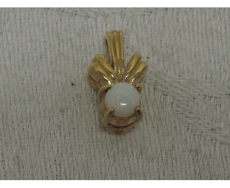 An opal pendant in a 9ct gold moulded mount