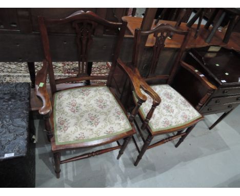 A pair of late Victorian/Edwardian stained frame carver armchairs, having vase splat backs with later tapestry seats and ring