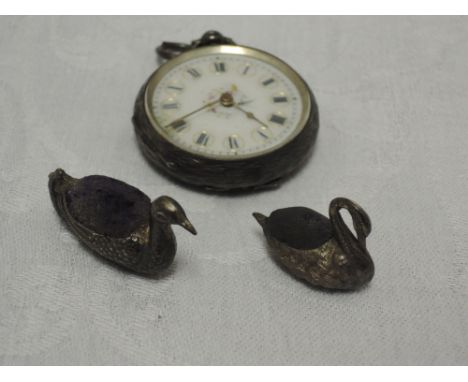 A miniature Edwardian silver pin cushion in the form of a duck, Chester 1906, Sampson Mordan &amp; Co Ltd, a similar miniatur