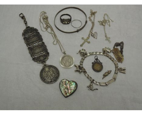 A small selection of white metal and HM silver jewellery including bangle, pendants, charm bracelet etc