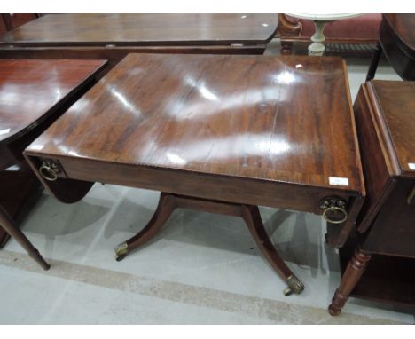 A 20th century mahogany period style sofa table having flap top with frieze drawers and splay legs