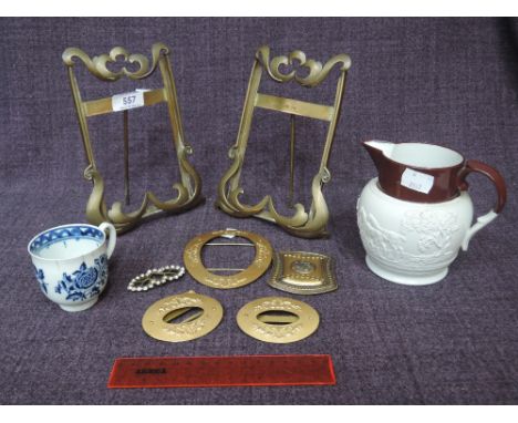 A late 18th century Worcester style blue and white cup, a 19th century hunting jug and a selection of brass buckles and Art N