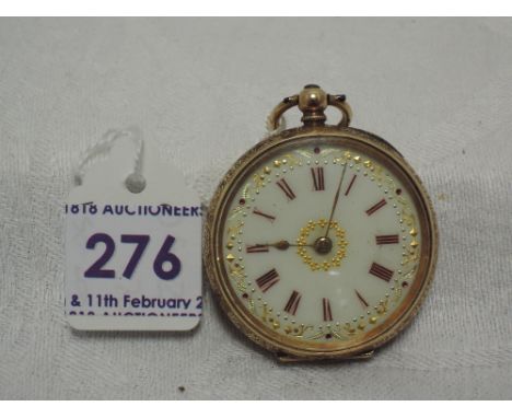 A yellow metal key wound pocket watch stamped 14K having a Roman numeral dial to gilt decorated enamel face in an extensively