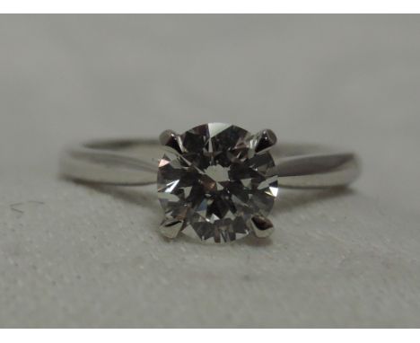 A lady's diamond solitaire dress ring, approx 1ct in a 4 claw mount on a platinum loop, size L/MCondition Reportstone is nice