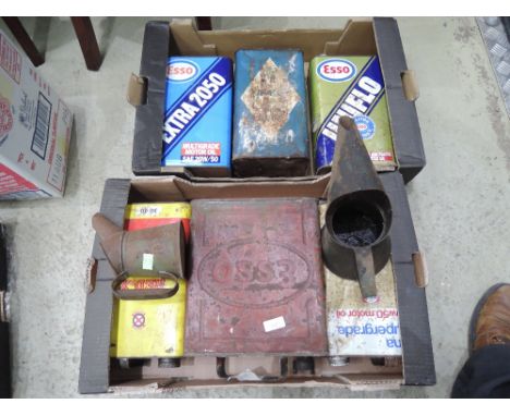 A selection of vintage oil cans, an Esso fuel can with a brass lid as well as two oil cans