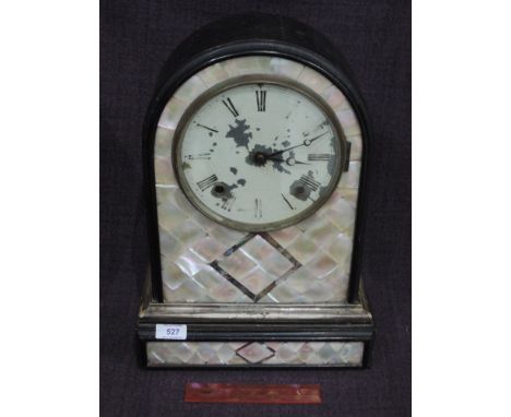 A Victorian mantel clock of arch design having mother of pearl  tile decoration and striking movement