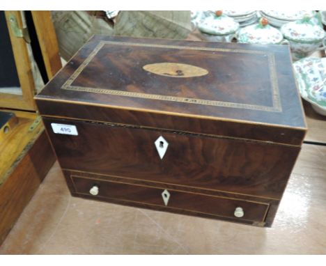 An early 19th century mahogany box of tea caddy form having later interior and drawer base with inlay decoration and brass co