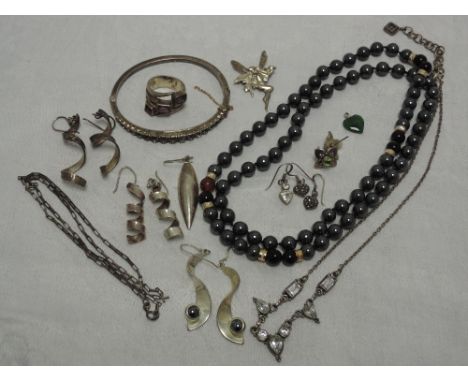 A selection of HM silver and white metal jewellery stamped 925 including hinged bangle, chains and earrings, and a string of 