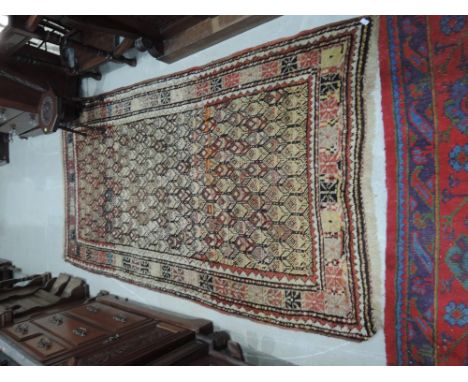 A carpet square of Eastern design having cream and brown ground