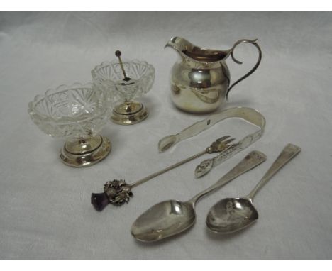 A small silver cream jug of helmet form having loop handle and gadrooned rim, Birmingham 1916, T H Hazelwood, a pair of cut g