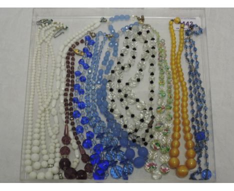 Nine vintage strings of beads including marbled crystal, amethyst style etc 