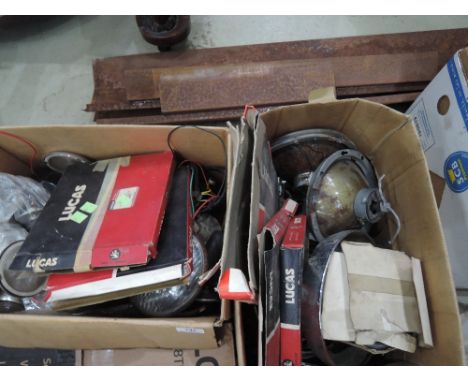 Two boxes of Jaguar lights and light parts
