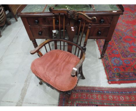 An early 20th century beech and elm armchair of continental style having spindle and shield back, with leather studded seat a