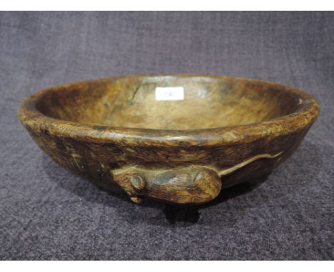 An oak circular bowl by Robert Mouseman Thompson of Kilburn, with adzed detail and typical carved mouse motif to sideVery use