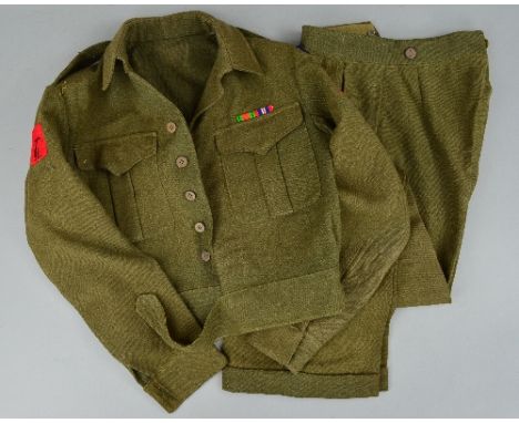 A BRITISH WWII ERA UNIFORM JACKET/TROUSERS, belonging to a soldier from the 'Royal Signals', the jacket is complete with shou