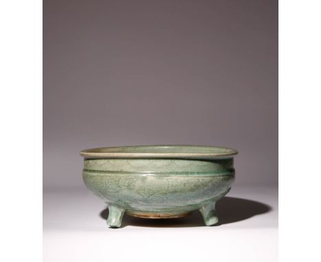 A LARGE CHINESE LONGQUAN CELADON TRIPOD INCENSE BURNER MING DYNASTY The deep rounded sides rising to a slightly everted rim, 