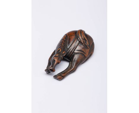 A JAPANESE BOXWOOD NETSUKE OF A HORSE EDO OR MEIJI, 19TH CENTURY Depicted standing, with its feet together and its head lower