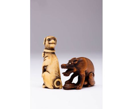 A JAPANESE STAG ANTLER NETSUKE OF A DOG EDO PERIOD, 18TH OR 19TH CENTURY Depicted seated on its haunches, its head turned tow