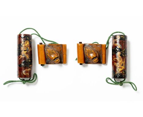 A JAPANESE CYLINDRICAL FOUR-CASE LACQUER INRO MEIJI ERA, 19TH CENTURY Decorated with two scaly dragons writhing amongst scrol