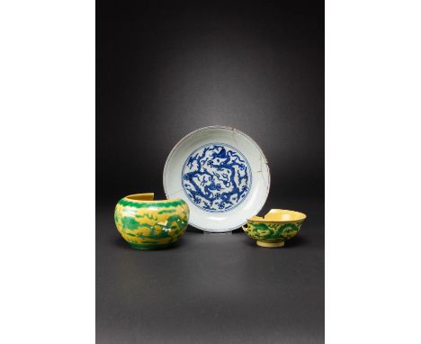 A CHINESE BLUE AND WHITE DISH AND TWO YELLOW-GROUND AND GREEN-ENAMELLED ITEMS JIAJING AND KANGXI MARKS AND OF THE PERIOD The 