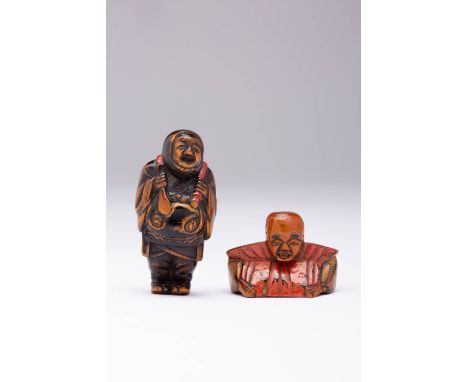 TWO JAPANESE LACQUERED WOOD NETSUKE EDO OR MEIJI, 19TH CENTURY The taller one depicting a Shinto priest carrying a large moku