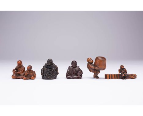 FOUR JAPANESE WOOD NETSUKE MEIJI ERA, 19TH CENTURY All depicting figures engaged in various activities: one an elderly man an