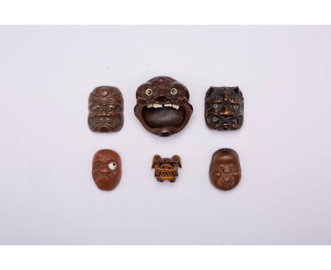 A COLLECTION OF JAPANESE MASKS MEIJI ERA, 19TH/20TH CENTURY Comprising: a large ashtray carved as a demonic face with its mou