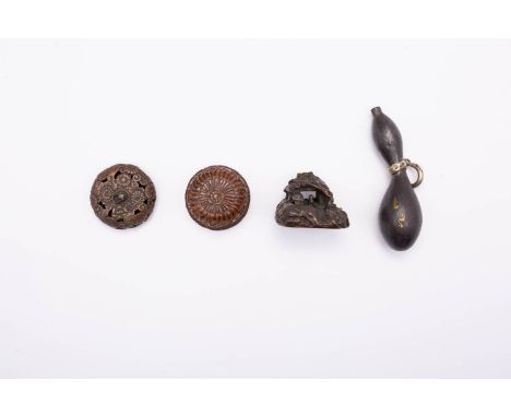 FOUR JAPANESE NETSUKE EDO AND MEIJI, 18TH AND 19TH CENTURY One carved in wood and depicting an ornate cage or basket, the sid