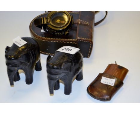 A War issue Military Compass, leather case, c 1917; other leather cases, ebony elephants
