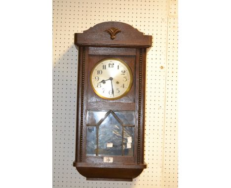 An oak wall clock, Arabic numerals, 1930s