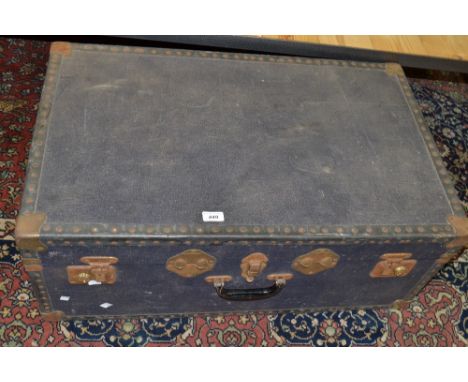 A mid twentieth century  blue canvas and metal bound rectangular travel trunk 