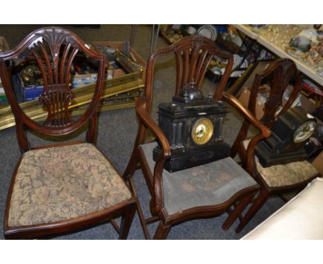 A pair of mahogany Chippendale revival dining chairs, a similar carver