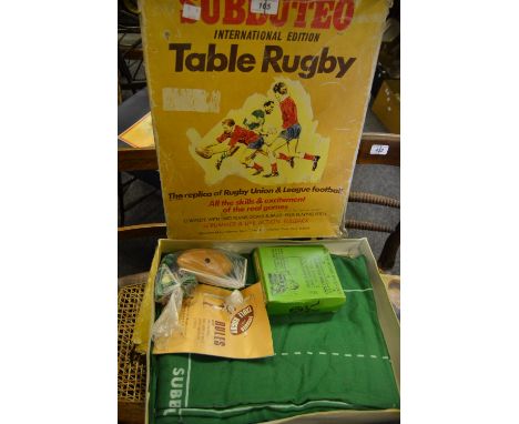 A Merit electric Derby Horse Racing game; another manual; a Subbuteo International Edition table Rugby 