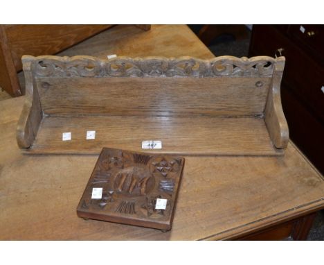 An early 20th century oak wall shelf carved  with scrolls; a hardwood teapot stand (2)