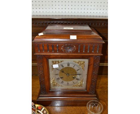 A late 19th century walnut mantel clock, silvered dials, Roman numerals c.1890 