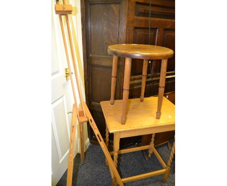 An oak rectangular barley twist occasional table, c.1930; a metamorphic table/firescreen; an easel