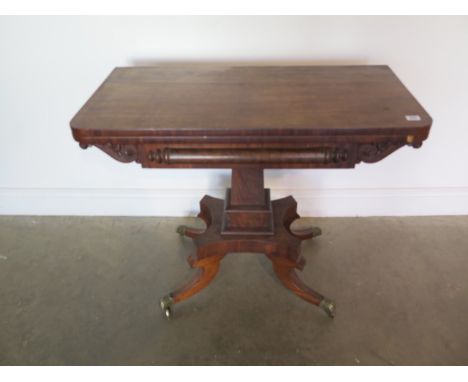 A 19th century mahogany fold over card table on a quatrefoil base with splayed legs, 76cm tall x 92cm wide 