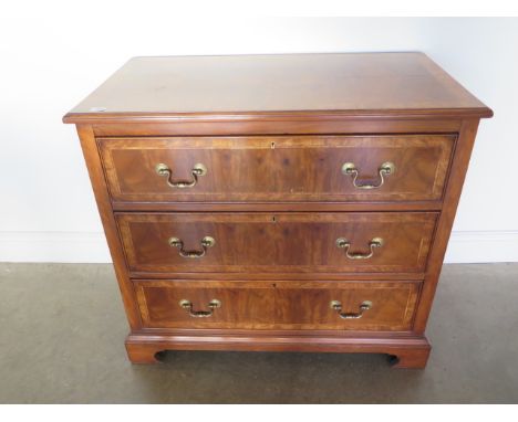 A walnut veneered three drawer chest on bracket feet, made by a local craftsman incorporating older timbers - 83cm tall x 91c