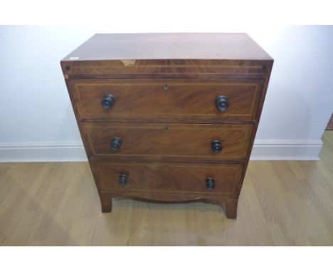A Georgian mahogany three drawer chest, on splayed bracket feet - 89cm tall x 77cm x 44cm 