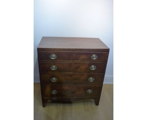 A Georgian mahogany four drawer chest on bracket feet - damage and repair to one back leg, 90cm tall x 82cm x 45cm 