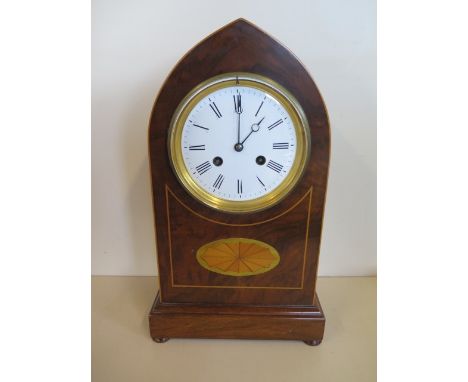 A lancet inlaid mahogany mantle clock striking on a bell, in running order, 37cm tall 