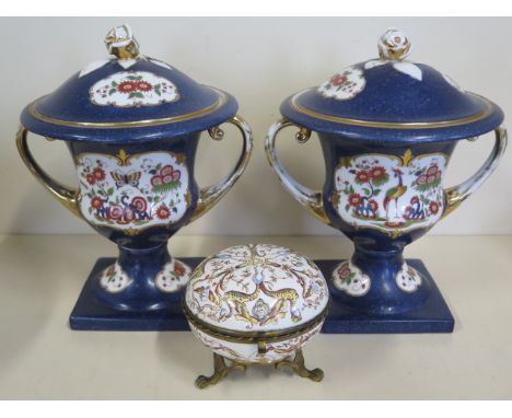 A pair of lidded twin handle campana shape vases, 23 cm tall, and a Limoges type ormulu mounted trinket box, one vase cracked