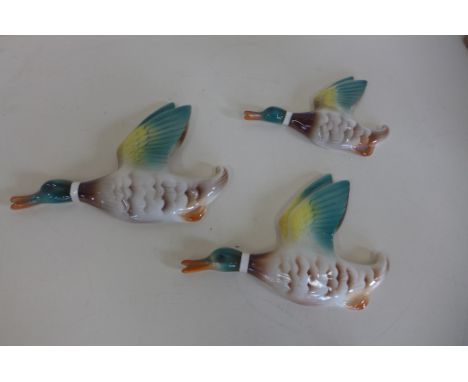 Three ceramic flying ducks, largest 19cm, all good 